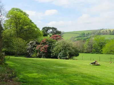 a person sitting in a field of green grass at Isolda's - Ukc3905 in Lostwithiel