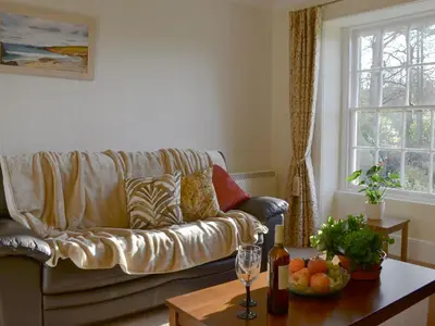 a living room with a couch and a table at Tristan's - Ukc3906 in Lostwithiel