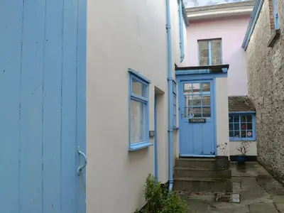 a house with a blue door and stairs in front at Tristan's - Ukc3906 in Lostwithiel