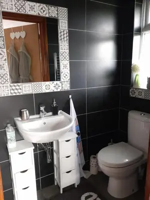 a bathroom with a sink and a toilet at Sailaway in Carbis Bay