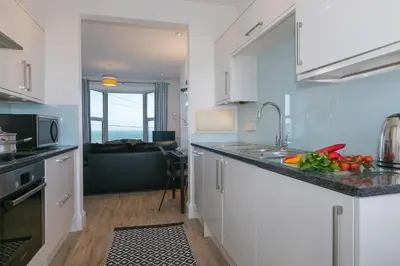 a kitchen with a sink and a counter top at Sea Crest in St Ives