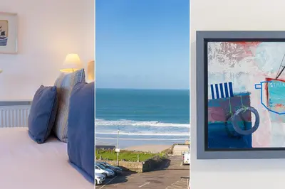 a room with a bed with a view of the ocean at SeaCrest 2 in St Ives