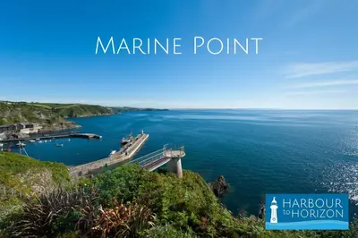 a view of a body of water with the words marine point at Marine Point, Mevagissey - sensational cliff top views of harbour and bay in Mevagissey