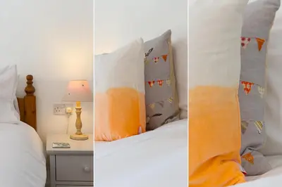 three pictures of a bedroom with a bed and pillows at 85 Back Road East in St Ives