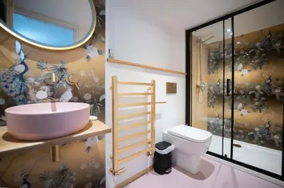 a bathroom with a sink and a toilet at Mariner's Belle in St Ives