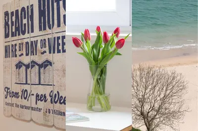 a vase of red tulips on a table next to a sign at 35 Carrack Widden in St Ives