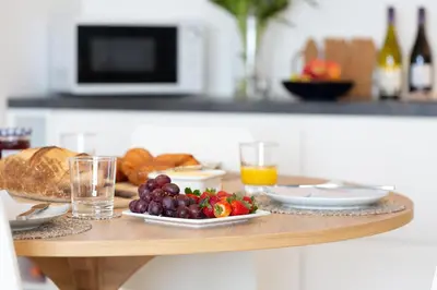 a table with a plate of food and fruit on it at 35 Carrack Widden in St Ives