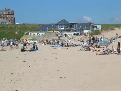 a large group of people on a beach at Harrington Flats in Newquay