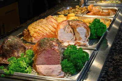 a tray of food with meat and broccoli on it at The Victoria Inn in Truro