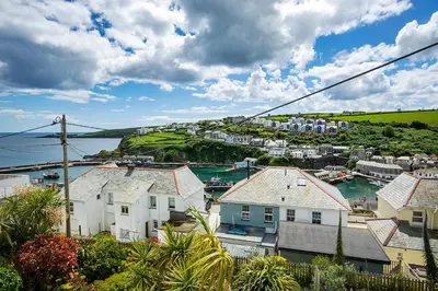 a view of a town with houses and a harbor at Seafarers, Mevagissey - Coastguard Cottage overlooking harbour in Mevagissey