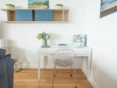 a white desk with a chair in a room at Onshore 6 - Newquay Towan Beach View in Newquay