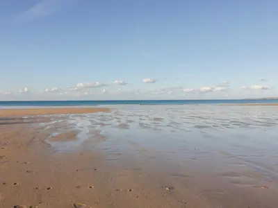 a sandy beach with footprints in the sand at Onshore 6 - Newquay Towan Beach View in Newquay