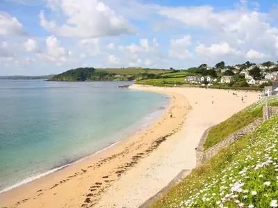 a view of a beach with people walking on it at Hazel Barn in Falmouth