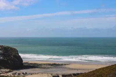 a view of a beach with the ocean at Hay Loft in Camborne