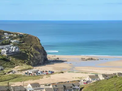 a view of a beach with houses and the ocean at Hay Loft in Camborne