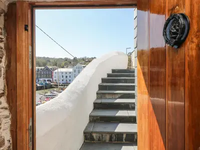 a stairway leading up to the top of a building at Glanville House in Mevagissey
