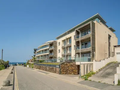 an apartment building on the side of a street at 7 Cribbar in Newquay