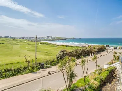 an aerial view of a golf course and the ocean at 7 Cribbar in Newquay