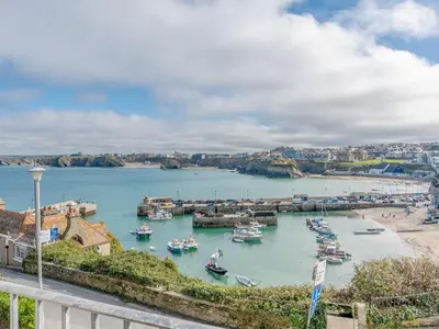 a view of a harbor with boats in the water at 6 Harbour View in Newquay