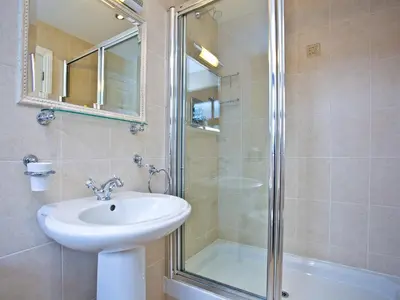 a bathroom with a sink and a shower at Holly in Saint Wenn