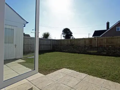 a view of a yard with a fence at 6 Jubilee Close in St Merryn