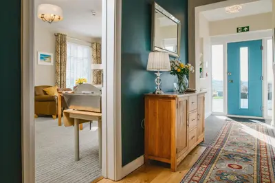 a bathroom with a sink and a mirror on a wall at Haven Lodge Newquay in Newquay