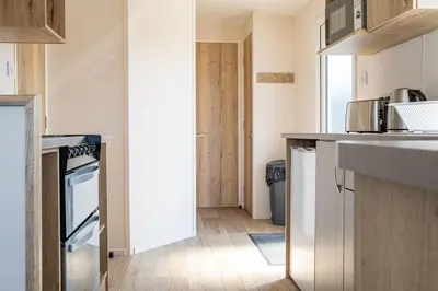 a kitchen with a sink and a stove at Cornish Coasts Holiday Park in Bude