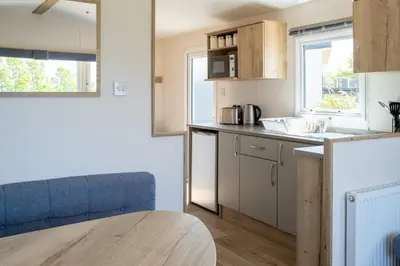 a kitchen with a sink and a counter top at Cornish Coasts Holiday Park in Bude