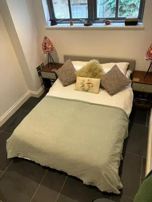 a bed with pillows on it in a room at The Engine House in Truro