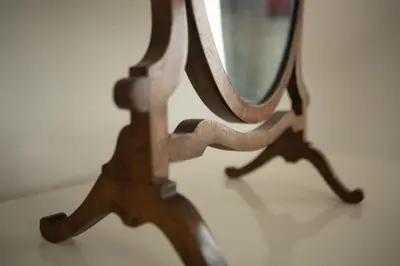 a close up of a mirror on a table at Warwick Lodge in Perranporth