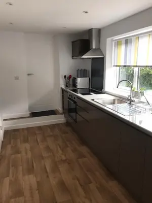 a kitchen with a sink and a counter top at Talland Studio in St Ives