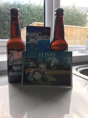 two bottles of beer sitting on top of a counter at Talland Studio in St Ives
