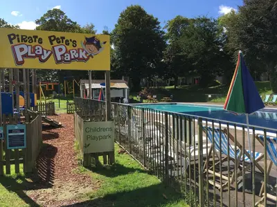 a park with a play park sign next to a playground at Newquay Villa 127 in Newquay