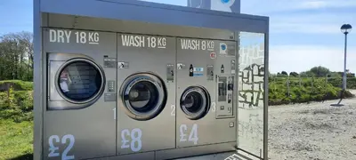 a couple of washing machines sitting in a building at Newquay Villa 127 in Newquay