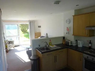 a kitchen with a sink and a counter top at Newquay Villa 127 in Newquay