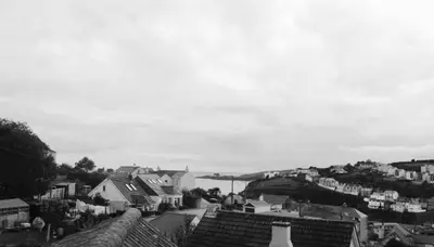 a black and white photo of a town with houses at Tregorran Guest House Mevagissey in Mevagissey