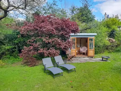 a tiny house in the middle of a yard at Ladyvale Barn in Cardinham