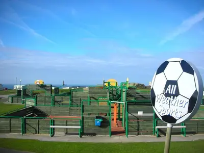 a soccer ball on top of a playground at Chalet 151, Perran Sands in Perranporth