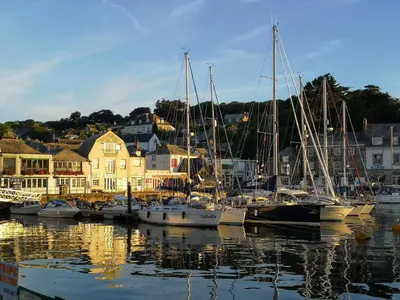 a group of boats are docked in a harbor at Samphire in Padstow