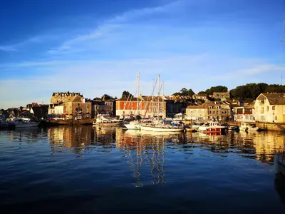 a group of boats are docked in a harbor at Samphire in Padstow