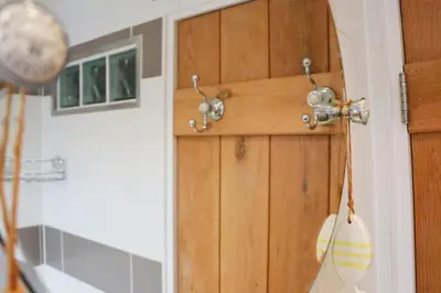 a close up of a wooden door in a room at TOWN CENTRE contemporary cottage in Padstow