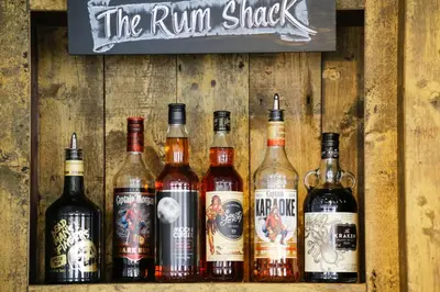 a group of different bottles of alcohol on a wall at The Swan Hotel in Wadebridge