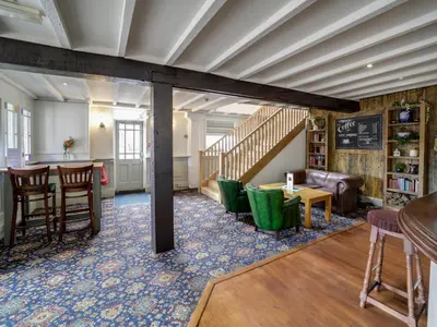 a living room with a couch and a table at The Swan Hotel in Wadebridge