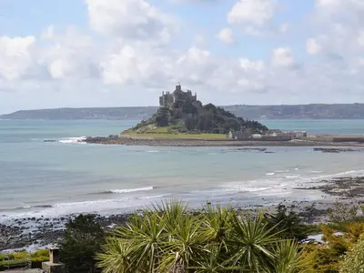 a castle on an island in the ocean at Bruce's Cottage in Saint Erth