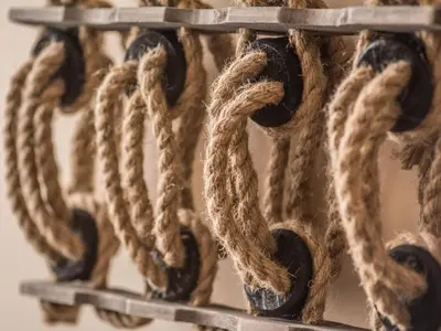 a group of ropes hanging on a metal rack at Deluxe Rustic Charlestown Themed Apartment in St Austell
