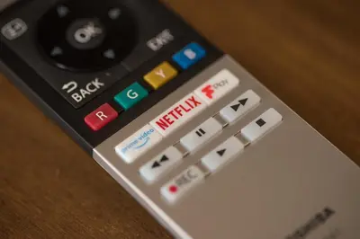 a remote control sitting on top of a table at Deluxe Rustic Charlestown Themed Apartment in St Austell