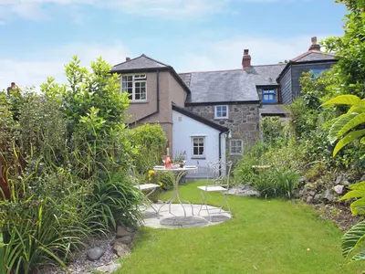 an exterior view of a house with a garden at Pippin in St Ives