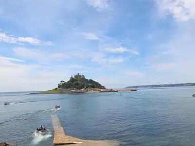 a small island in the water with a castle on it at Sea Spray in Marazion