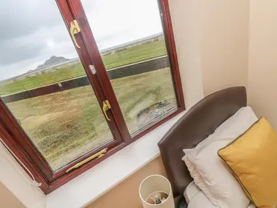 a room with a chair and a window at Sea Horses in Marazion