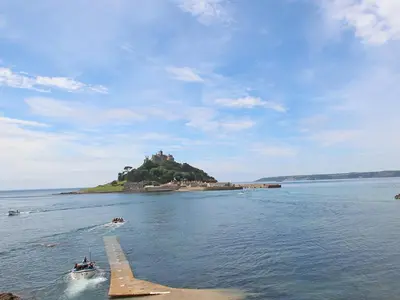 an island in the water with a castle on it at Sea Horses in Marazion